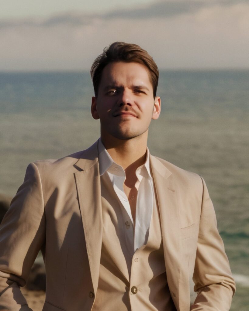 Nikolay Ayerov on a Beach in a Cream suit